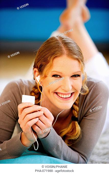 Woman listening music with a MP3 player