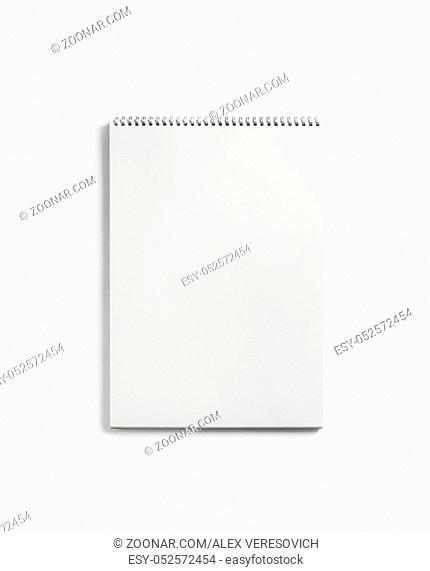 Blank notepad for sketching on white paper background. Album with spiral. Free space. Flat lay