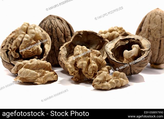 close view detail of some walnuts isolated on a white background