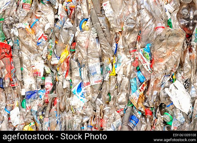 Plastic Bottles in Extruded Form at a Plant for Processing Raw Materials. PET Recycling Plant. Close Up Shoot