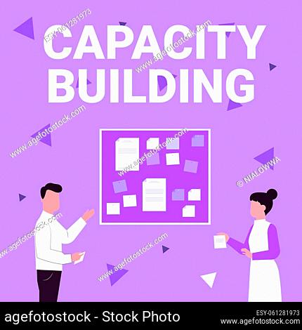 Sign displaying Capacity Building, Concept meaning process by which individuals gain knowledge and skills Illustration Of Couple Presenting Ideas Holding Notes...