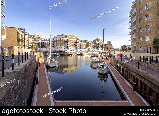 Boats and yachts moored at Limehouse Basin Marina, near Canary wharf riverside area, London city, United Kingdom