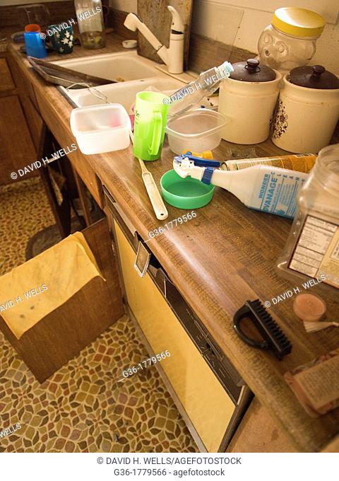 Mess and unkept counter inside of a foreclosed home in Fresno, California, United States
