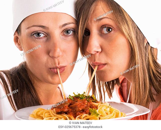 Chefs with spaghetti bolognese