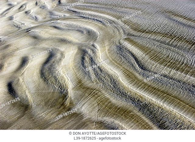 Low Tide is sand ripples on Crescent Beach in Florida. USA