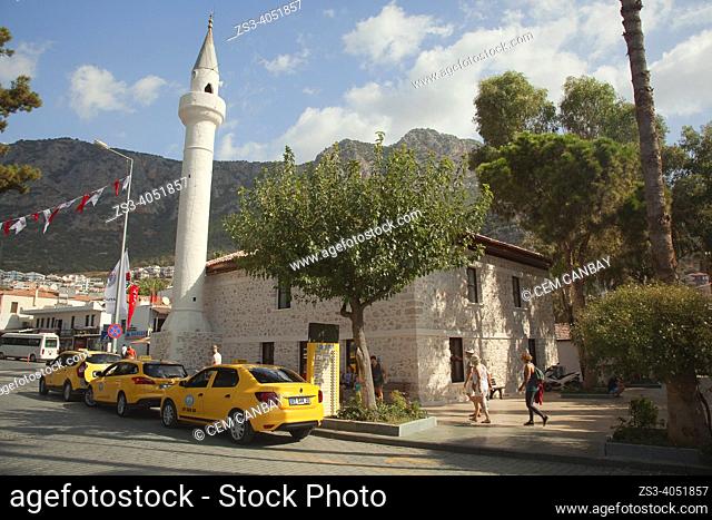 Tourists at the street in front of the Merkez Suleyman Cavus Mosque in Kas village, Antalya Province, Mediterranean Coast, Ancient Lycia Region, Turkish Riviera