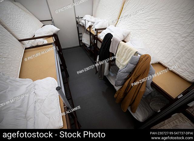 PRODUCTION - 26 July 2023, Berlin: View of a sleeping quarter at the Tegel arrival center. The refugee accommodation at the former Tegel Airport houses around 2