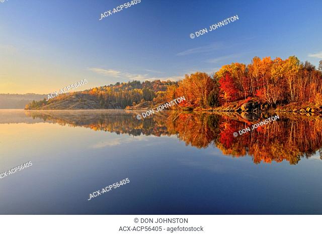 Simon Lake with morning fog and autumn reflections, Greater Sudbury Naughton, Ontario, Canada