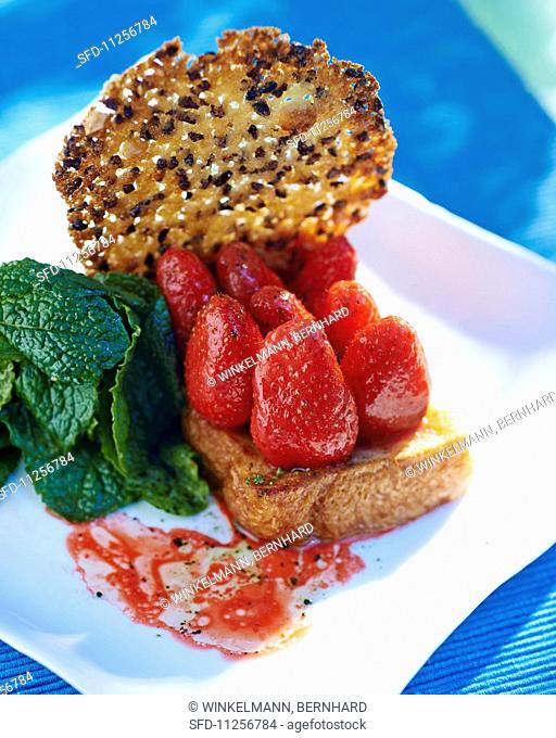 French toast with marinated strawberries, sesame brittle and mint