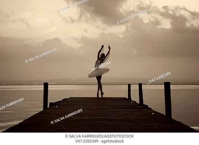 Ballet dancer dancing in the lake harbor, Albufera, Valencia, Spain, Europe