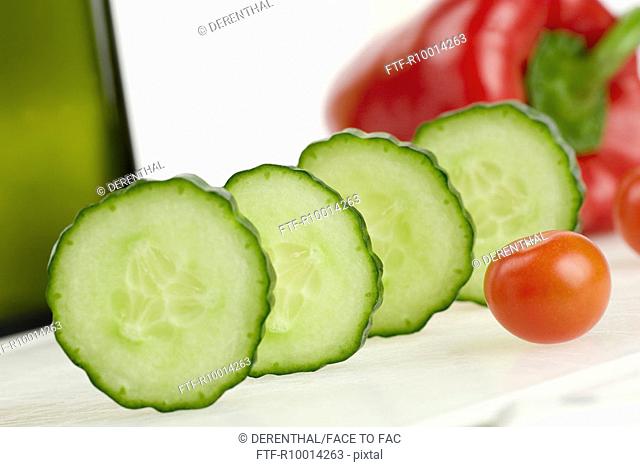 Slices of a cucumber, Tomato and capsicum