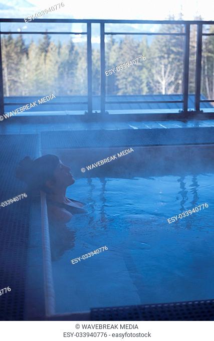 Woman relaxing in hot tub