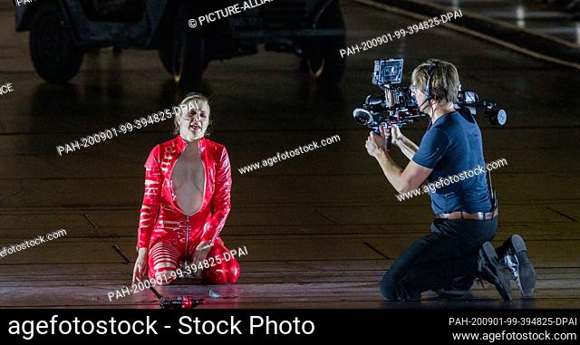 01 September 2020, Hamburg: The singer Valery Tscheplanowa in the role of the actress kneels on the stage during the photo rehearsal of ""molto agitato""