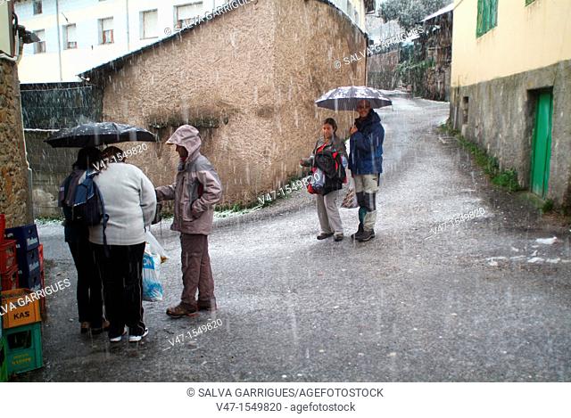 People under the rain, Cangas del Narcea, Asturias, Spain