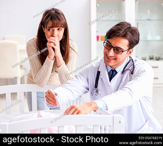 The doctor explaining to young mother