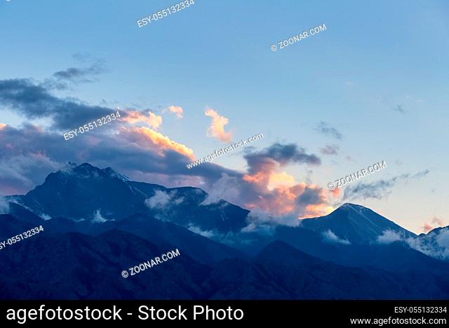 peak in sunset, beautiful clouds on the top of tianshan mountains