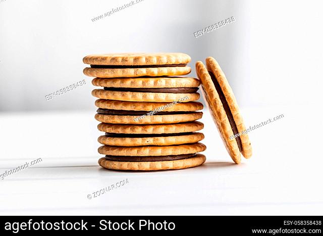 Sandwich cookies. Sweet biscuits with cream on white table