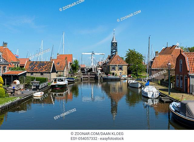 Picturesque buildings, harbor and church in Hindeloopen at the IJsselmeer with in province Friesland near Lemmer, The Netherlands, image Daan Kloeg, Commee