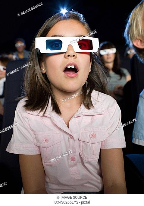 A girl watching a 3d movie