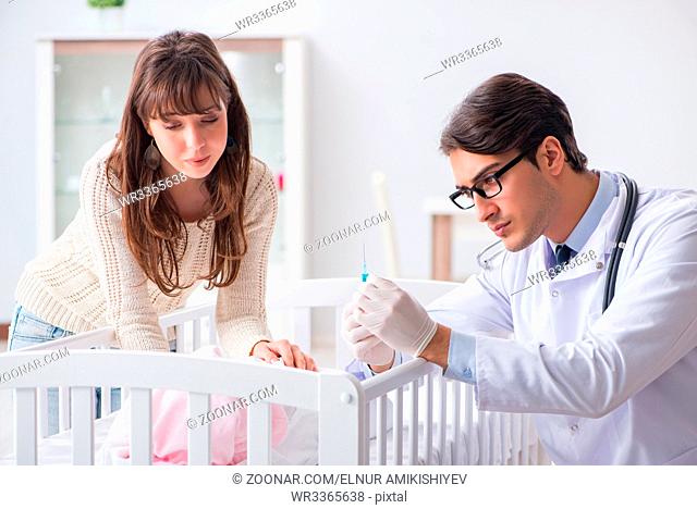 Doctor explaining to young mother