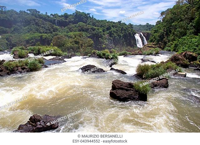 View of Iguazu River and a section of the Iguazu Falls, from the Brazil side. Iguazu Falls are waterfalls of Iguazu River on the border of the Argentine...