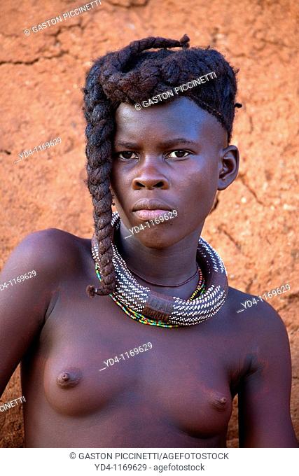 Himba girl, with the typical double plait hairstyle and necklace, Damaraland region, Namibia