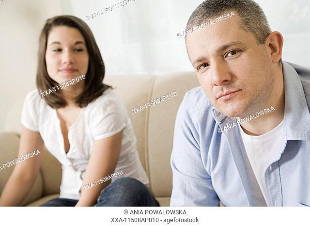 father talking with teenager