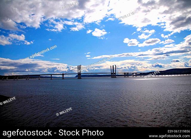 Dramatic picture of the Governator Cuomo bridge with blue sky and white clouds on the Hudson River in the New York State