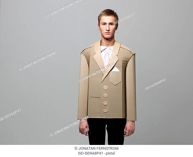 Man wearing jacket made out of corrugated cardboard