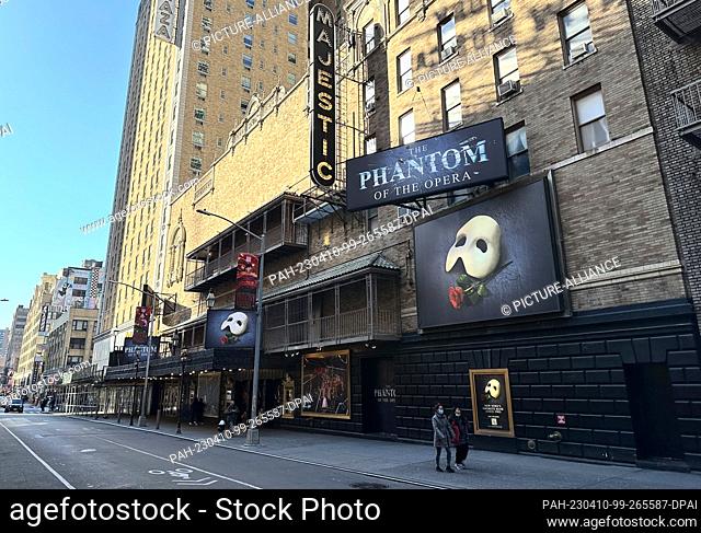 09 April 2023, USA, New York: Passers-by walk past the Majestic Theatre on Broadway. After more than 35 years, ""The Phantom of the Opera"" will be performed...