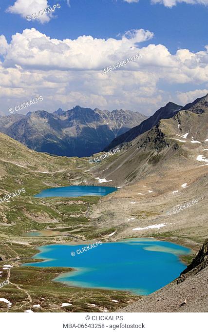 Clouds on the turquoise lakes surrounded by rocky peaks Joriseen Jörifless Pass canton of Graubünden Engadin Switzerland Europe
