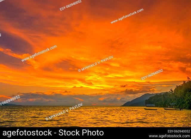Indonesia. Tropical ocean coast. Amazing color sky after sunset