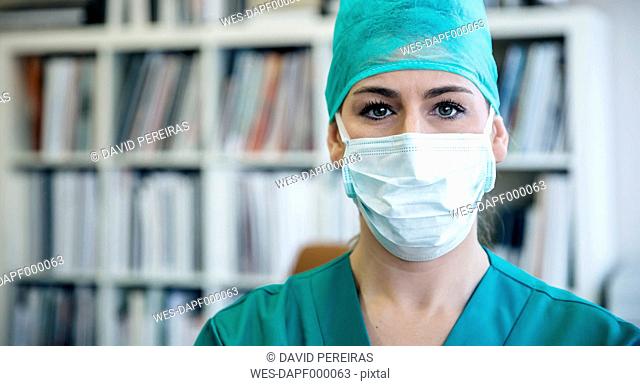 Portrait of doctor wearing mask and surgical cap
