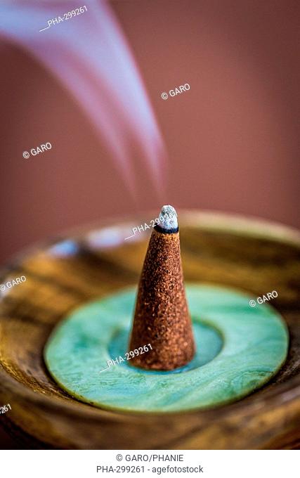 Burning incense cone