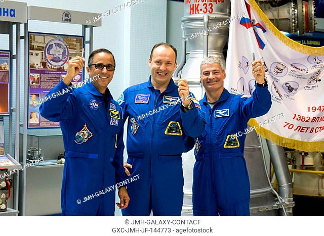 In the Korolev Museum at the Baikonur Cosmodrome in Kazakhstan, Expedition 53-54 crewmembers Joe Acaba of NASA (left), Alexander Misurkin of Roscosmos (center)...