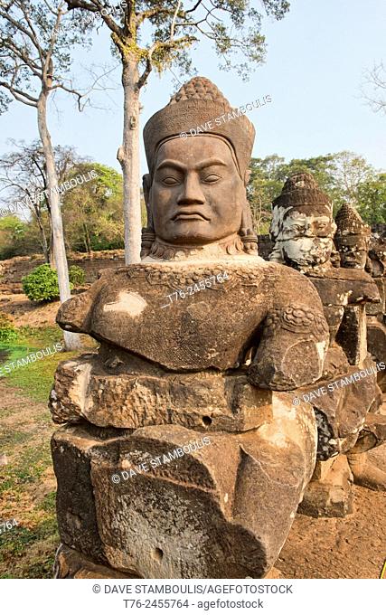 Giant stone head at the South Gate of Angkor Thom at Angkor Wat in Siem Reap, Cambodia