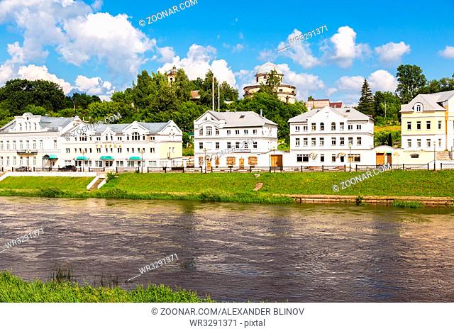 Torzhok, Russia - July 16, 2017: Provincial Russian town of Torzhok in summer sunny day. Old buildings at the embankment of the Tvertsa river