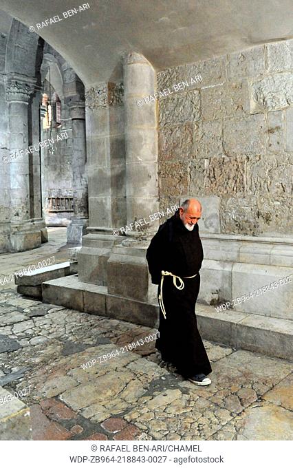 JERUSALEM - NOVEMBER 05:Monk at the Church of the Holy Sepulchre November 05 2010 in Jerusalem, Israel. The Church of the Holy Sepulchre is considered the...