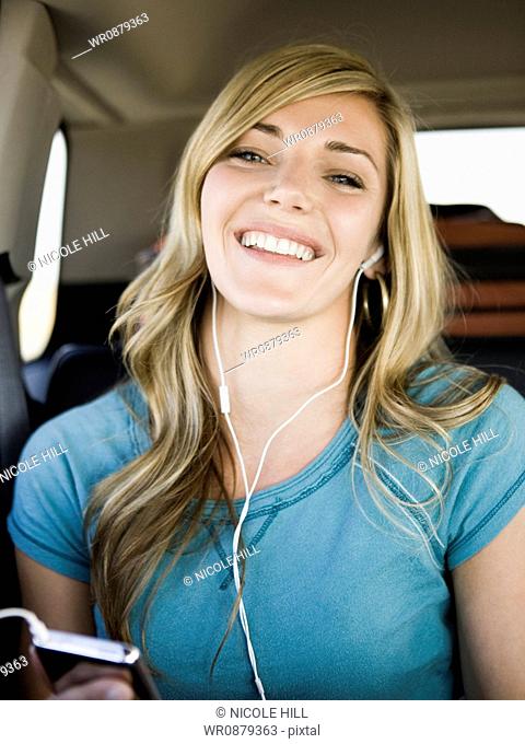 woman listening to music on a car ride