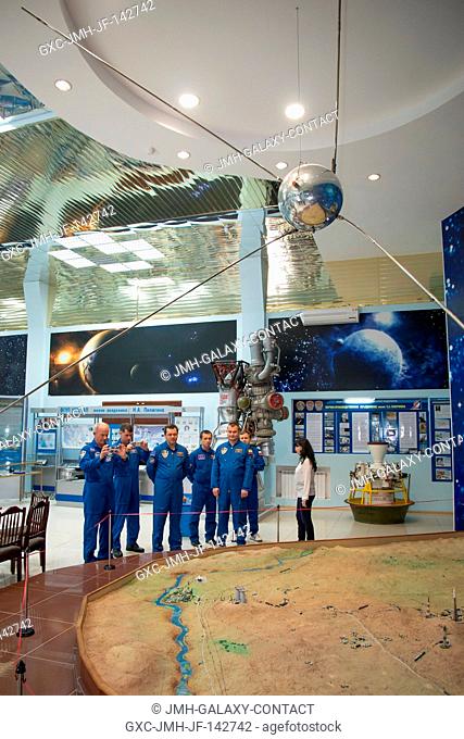 In the Korolev Museum at the Baikonur Cosmodrome in Kazakhstan, the Expedition 47-48 prime and backup crewmembers play tourist as they are shown a bas relief...