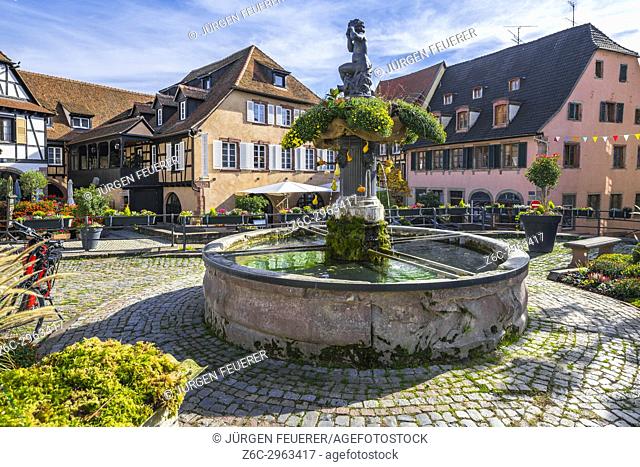 fountain and old houses in the centre of the village Barr, on the Wine Route of Alsace, France
