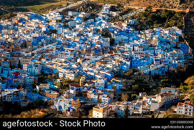 Houses in chefchaouen are all painted in blue. This beautiful cityscape is seen from a sunset viewpoint above the town