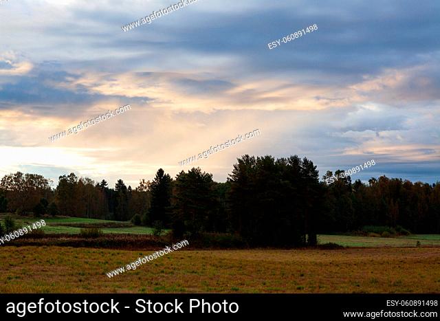 Beautiful clouds over countryside landscape at dawn