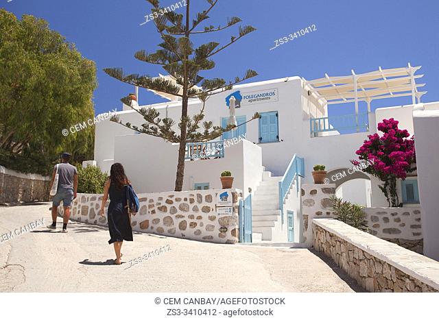 Tourist walking in the street at the town center Chora, Folegandros, Cyclades Islands, Greek Islands, Greece, Europe