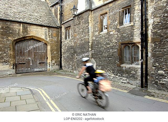 England, Oxfordshire, Oxford, A cyclist in the streets of Oxford. Oxford became a city in 1542 and is known as the ' city of dreaming spires'
