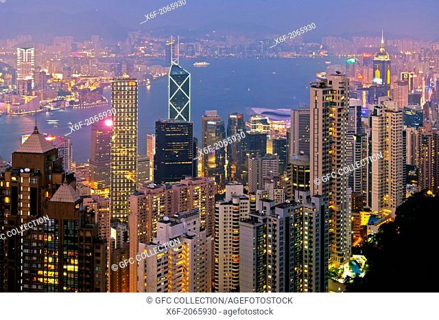 Night view across the skyscrapers in Central District and the Victoria Harbour to Kowloon, Hong Kong