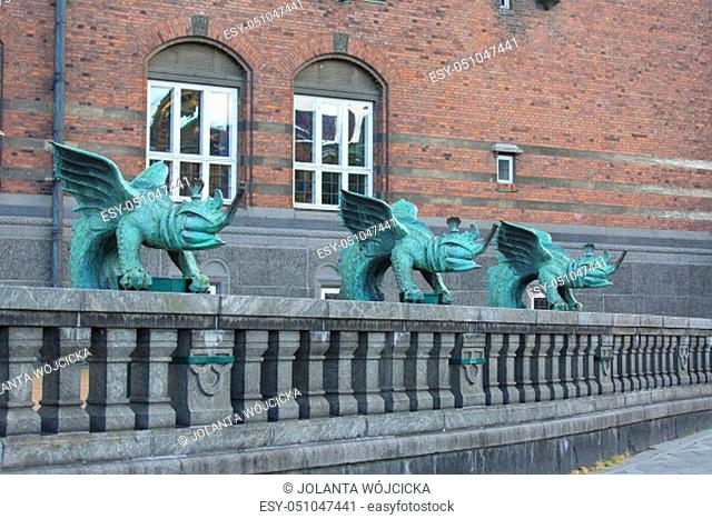 Copenhagen City Hall, green mascarons on the fence at the entrance to the building, Copenhagen, Denmark
