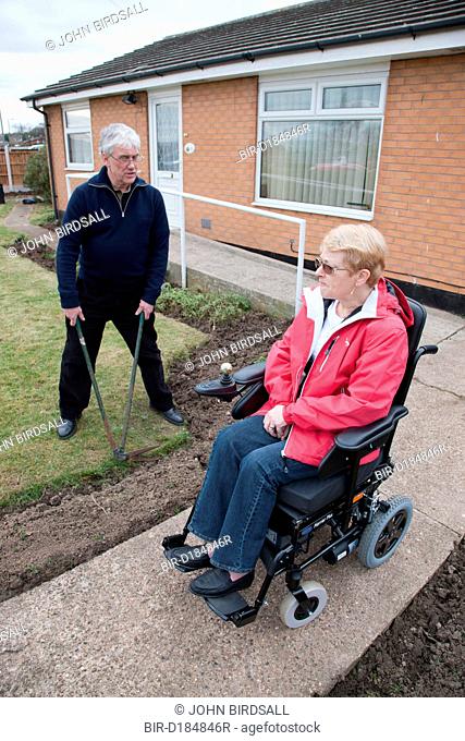 Husband and wife in adapted home gardening