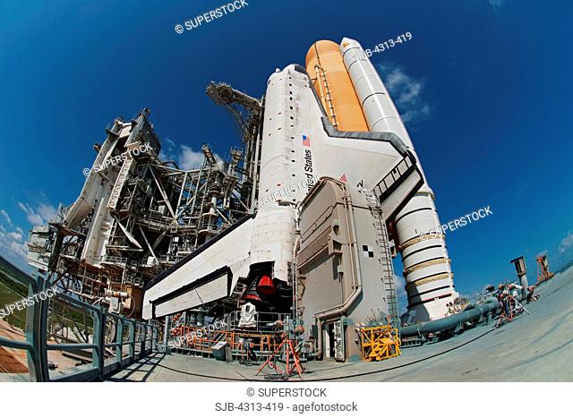 The Shuttle Discovery is poised for launch on its final mission, STS-133, after rollout to Pad 39A on September 21, 2010