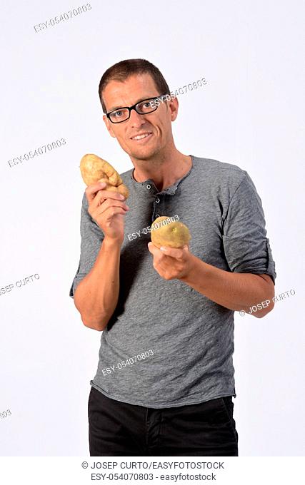 portrait of a man with potato on white background